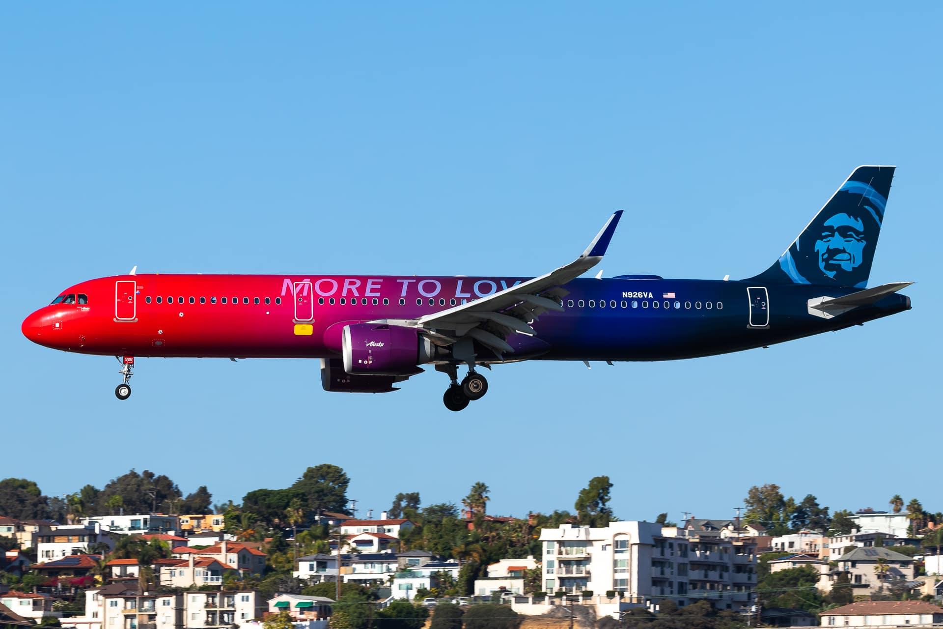 Alaska Airlines A321 in the "More to Love" livery landing at San Diego International Airport.