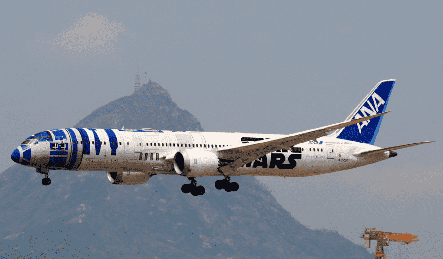 An ANA 787 decked in the R2-D2 livery on short final.