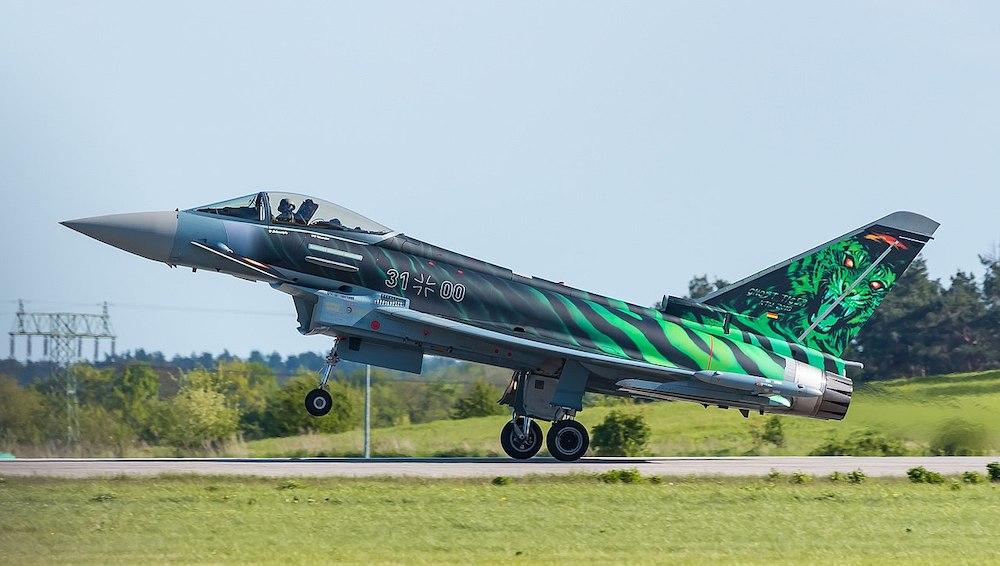 A German Air Force Ghost Tiger Typhoon taking off from the runway.